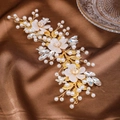 Detail of bridal hair vine with white flowers, pearls and crystals on brown satin - Gold