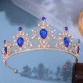 Elegant gold bridal crown featuring blue teardrop gemstones and white crystals - Gold Base Royal Blue Rhinestone