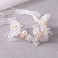 Handmade bridal headband with pearls, soft pink petals, blue flowers, and golden wire - Blue Bracelet