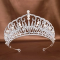 Silver bridal tiara with sparkling rhinestones and white pearls on brown velvet background - Artificial Pearl Silver
