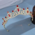 Elegant gold bridal crown with red rhinestones and crystal accents on a blue surface - Vintage Red Marquise Cut Rhinestone Style (293)