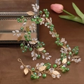 Handmade bridal headband with green crystals and gold leaves for wedding hair styling - Green