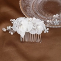 Close-up of white silk flowers and sparkling crystal star branches on bridal hair comb - Silver 2