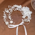 Bridal hair vine with white fabric flowers, pearls and crystals on brown satin background - Long Hair Vine
