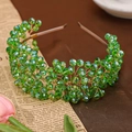 Handcrafted bridal headband with woven emerald green crystals on a gold wire frame - Green