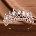 Luxurious rose gold bridal crown featuring pear-shaped white crystals on satin fabric - Rose Gold