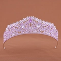 Detail shot of a silver-tone crown featuring purple rhinestones and intricate vortex patterns - Purple