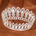 Detailed macro view of a luxury Baroque bridal crown with shimmering crystals on silk fabric - Silver White