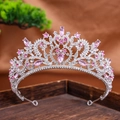 Macro detail of a silver-toned bridal tiara featuring pink rhinestones and scroll patterns - Silver Pink