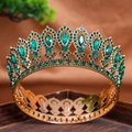 Detail of luxury baroque gold tiara featuring marquise green gemstones and sparkling rhinestones - Full Gold Green
