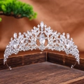 Luxurious silver bridal tiara featuring marquise-cut crystals on a rustic wood base - Silver