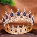 Macro shot of vintage gold alloy crown with deep purple crystals and clear rhinestones - Purple