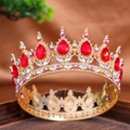 Luxurious vintage gold crown with pear-shaped red gemstones and iridescent crystals - Colorful