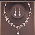 Elegant gold bridal jewelry set featuring pear-cut white rhinestones on necklace and earrings - Gold/Transparent