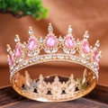 Elegant gold baroque crown featuring pink teardrop gems and sparkling white crystals - Pink