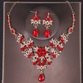 Elegant bridal jewelry set with red gemstones and gold finish in a floral design - Gold Red Style