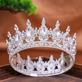 Silver crown headpiece featuring shimmering round and teardrop crystals for weddings - Silver