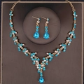 Elegant bridal jewelry set with lake blue crystals and gold finish necklace earrings - Gold With Lake Blue Zircon