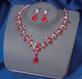 Elegant bridal necklace and earrings set featuring red teardrop crystals on silver base - Silver Red
