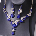 Exquisite bridal jewelry set with deep blue pear-cut stones and gold finish - Blue Gold