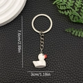Close-up of a 3cm white duck keychain on black leather with 7.6cm length dimension - White (LS49)