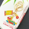 Porte-clés bateau-dragon doré avec pendentifs en émail et charmant sac de fortune rouge - Style de Bateau-Dragon (ER1553)