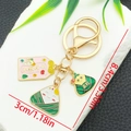 Porte-clés dessin animé Zongzi avec pendentifs rose et vert pour la Fête des Bateaux-Dragons - Style Paix Joie Zongzi (ER1562)