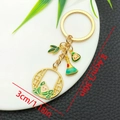 Cartoon Dragon Boat Festival golden keychain with zongzi charm and size measurements - Round Hollow Window Zongzi (ER1574)