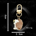 Cute hedgehog enamel keychain with dimensions 6cm height and 2.3cm width in antique silver - Enamel Hedgehog with Corn (LS08)