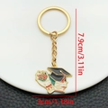 Porte-clés doré chapeau de diplômé avec breloques bouquet de fleurs et parchemin - Porte-clés Émail Fleurs Toque Livre (LS307)
