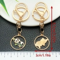 Cartoon panda metal keychain with gold plating and green bamboo oil drip design - Napping Panda (ER1066)