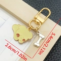 Cartoon cream puppy keychain with gold clasp and silver bone charm in oil-drop style - Yellow Puppy Style (LS366)