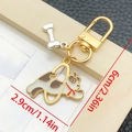 Cute brown enamel puppy keychain with bone charm and gold-plated U-shaped clasp - Yellow And White Hooping Dog Style (LS368)