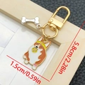 Cartoon Corgi dog keychain with enamel finish and small silver bone charm - Dog with Ball in Mouth (LS360)