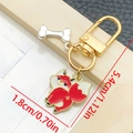 Cartoon red fox keychain with enamel finish and small silver bone charm on gold hardware - Red Fox Dog Style (LS370)