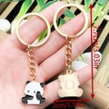 Cartoon panda metal keychain with gold finish and black white enamel showing dimensions - Drip Oil White Chinese Style Spacing Out Panda Style (ER1037)