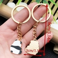 Portachiavi panda in metallo dorato con smalto e lunghezza totale di 8 cm - Stile Panda di Profilo (ER1047)