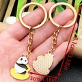 Cute panda with bamboo keychain set with golden ring and cloud pendant on hand - Panda on Rocking Horse Style (ER1030)