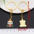 Set de porte-clés panda chinois doré avec signe de bénédiction, longueur de 8 cm - Panda Signe de Fortune Chinois Blanc en Émail