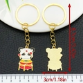 Cartoon panda keychain in gold finish showing front and back views, 8.7cm length - Drumming Panda (ER1015)