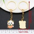 Golden panda keychain holding a persimmon with 'Everything goes well' text, 8.4cm length - Persimmon Ruyi Panda (ER1019)