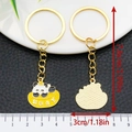 Cute panda with gold sycee keychain featuring lucky charm and enamel finish details - Fortune-bringing Panda (ER1020)