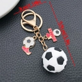 Detail view of a 3D soccer keychain with gold chain and soccer ball shoes charm - White Sports Series Soccer Style