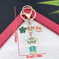 Leeuwendans sleutelhanger in groen met klavertje vier en gezondheidswens hanger - Emaille Groen Gezondheid Leeuw Klaver (ER2144)