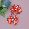 Detail of handmade bow hair clips with red hearts and LOVE print on white ribbon - White Base LOVE Heart Style (01#)