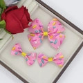 Detail van roze haarstrikken set met kleurrijke hagelslag print voor meisjesaccessoires - Roze Sprinkels