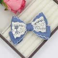 Vintage denim bow hair clip with white lace trim and floral embroidery on a jewelry box - Exquisite Lace Overlock Style (03#)
