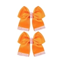 Détail de barrettes à nœuds orange avec des perles d'imitation blanches élégantes - Orange