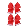 Detail of red ribbon bow hair clips with white faux pearl embellishments and texture - Red