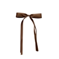 Macro detail of dark brown satin bow hair clip with elegant long ribbon streamers - Coffee